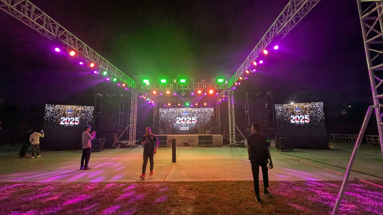 Lit dance floor under truss lighting