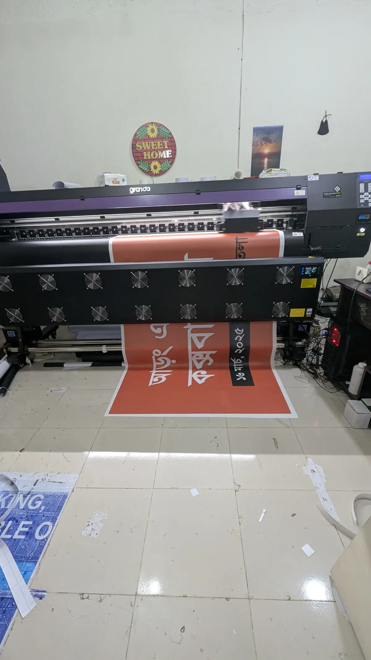 Printed banner coming off the machine