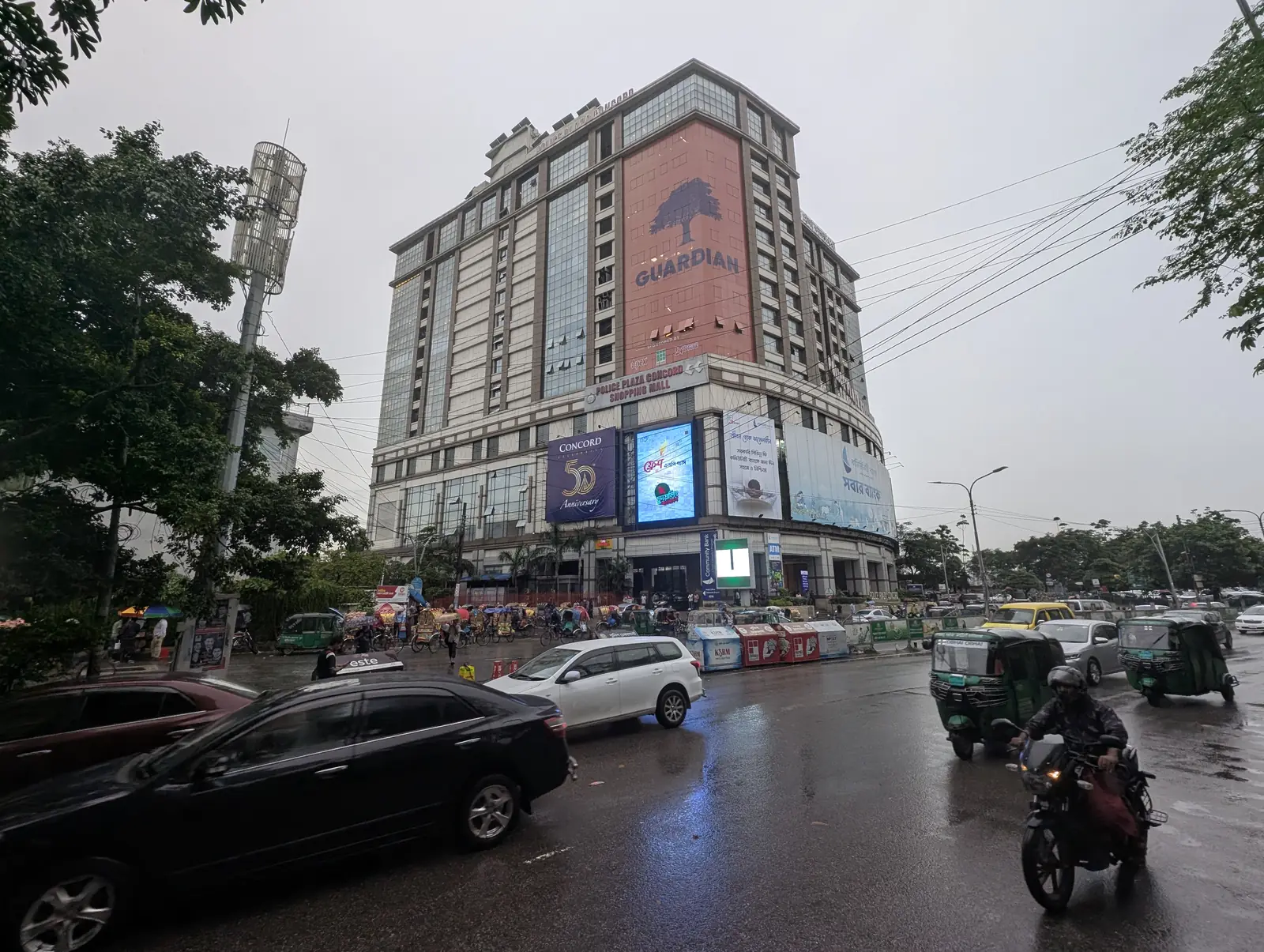 LED screens on a tower façade in the rain
