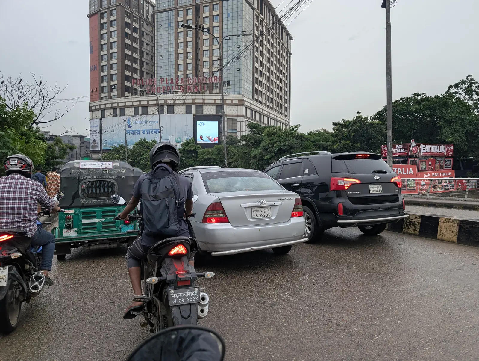 Traffic approaching a tower with LED screens