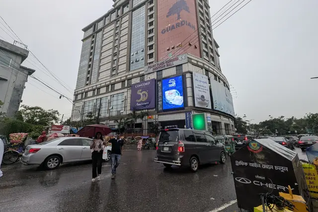 LED screens on a monsoon evening in Dhaka